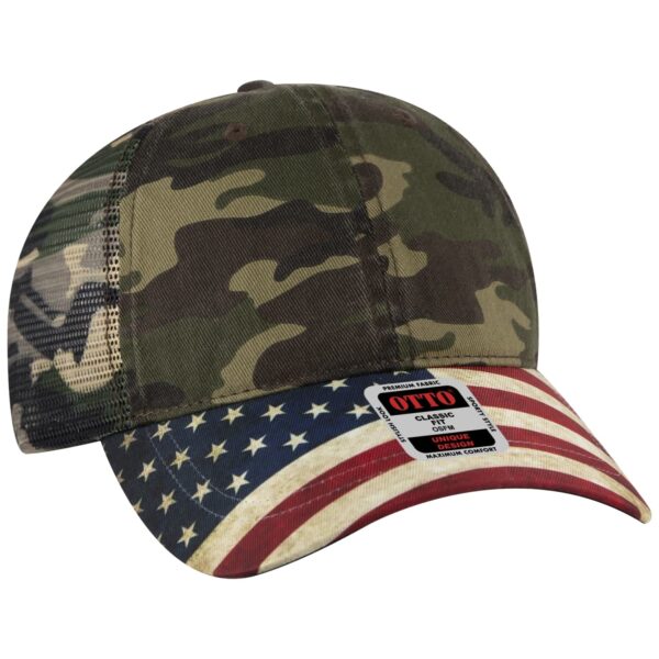 A camouflaged trucker hat with a curved brim featuring an American flag design and a logo on the side.