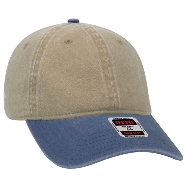 A beige and navy six-panel dad hat with a curved brim and a logo on the side.