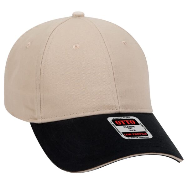 A beige and black 6 panel baseball cap with a logo, featuring a low profile design.