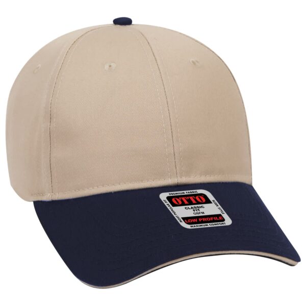 A beige and navy 6-panel baseball cap featuring a curved brim and a brand logo.