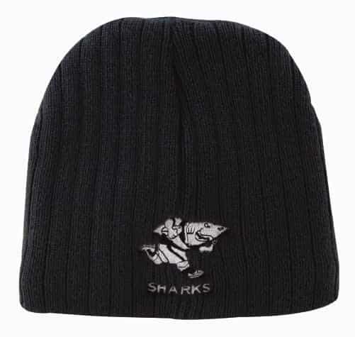 A black cable knit beanie featuring a logo of a shark.