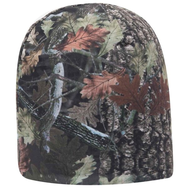 A reversible camo beanie featuring a detailed camouflage pattern with earthy tones of green, brown, and autumn leaves.