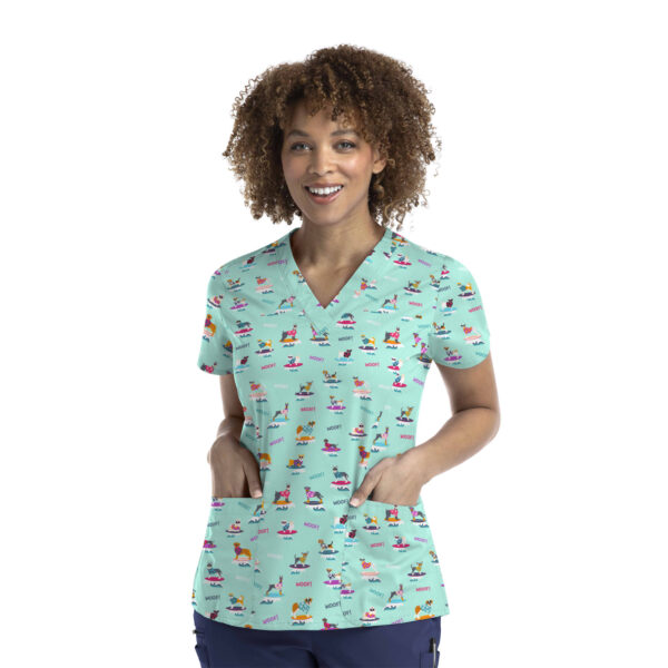 A printed curved V-neck top in mint green featuring a variety of colourful designs and a logo.