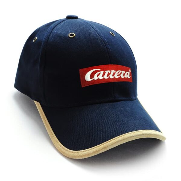A navy blue cap with a suede trim and a logo on the front.
