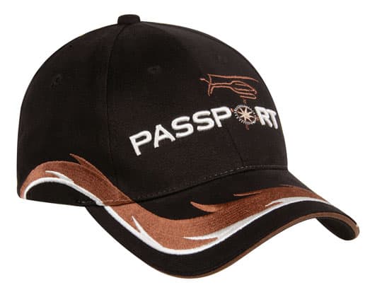 A black cap with a gold and white patterned design, featuring a logo on the front.