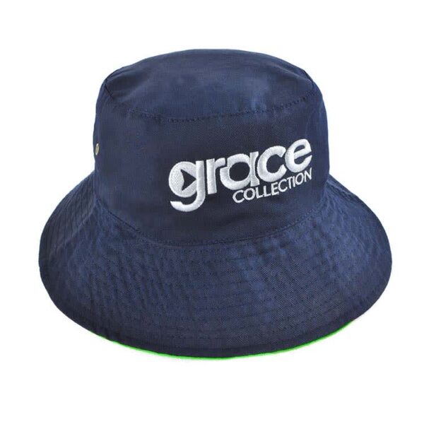 A reversible bucket hat in navy blue with a green underside and a logo on the front.