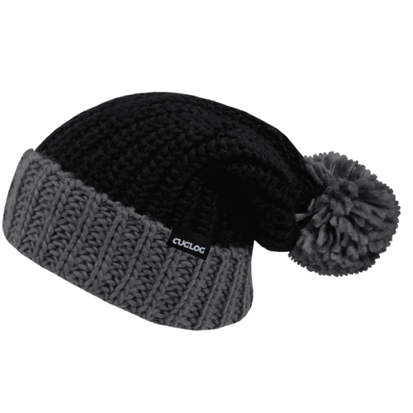 A black and grey knitted beanie with a pom-pom and a logo tag.