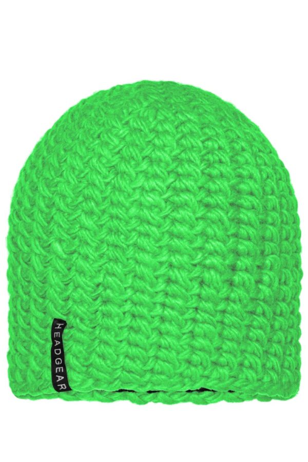 A bright green crocheted cap with a textured design and a brand label on the side.