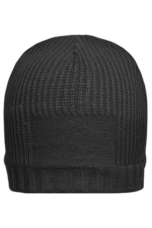 A black beanie with a ribbed texture and a logo patch on the side.