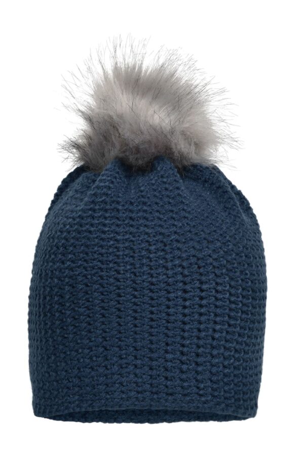 A fine crocheted beanie in navy blue with a grey fur pom-pom on top. It features a textured knit pattern.