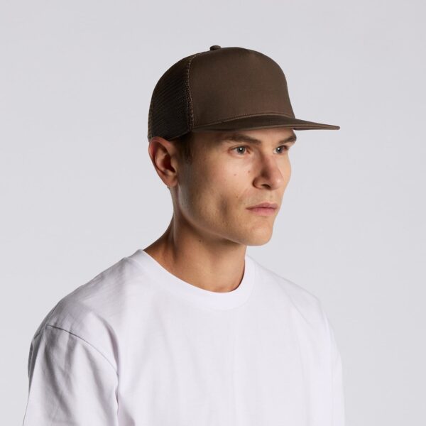 A brown trucker cap with a mesh back, worn by a person in a white t-shirt, facing sideways.