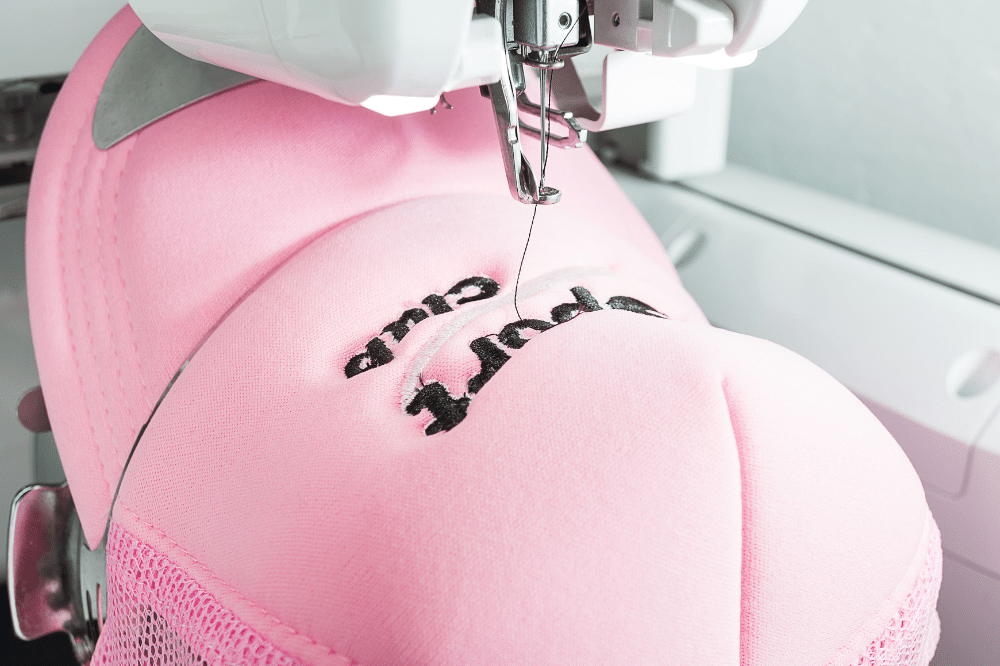 logo embroidery design tips for caps | A cap being embroidered