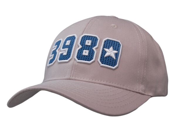 A beige cap with blue and white embroidered numbers and a star. It features a logo on the side.