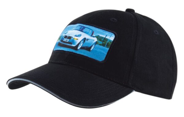 A black cap featuring a stitched patch of a white car. The cap has a curved brim and a logo stitched on it.