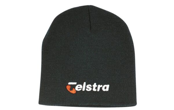 A rolled down acrylic beanie in dark grey, featuring a logo.