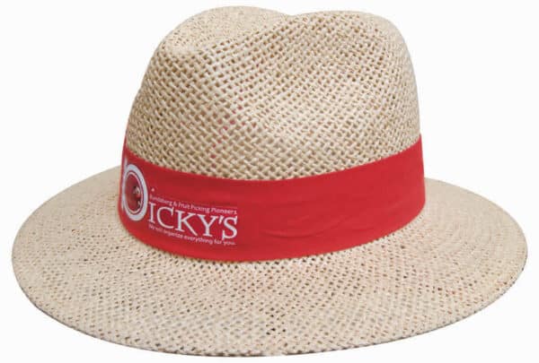 A straw hat with a wide brim, featuring a red band, and a logo on the side. The hat has a light, natural colour.
